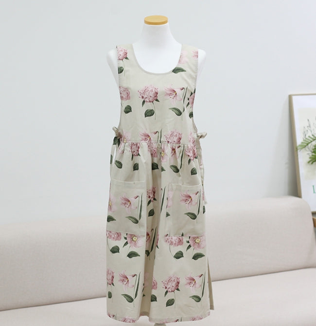 AURACASA Muse long apron with floral print in beige, burgundy, or navy, featuring front pockets and adjustable ties