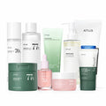 ANUA 9-step Korean skincare set with cleansers, toner, pads, serum, cream, lotion and sunscreen bottles